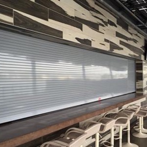 Close up side view of a counter shutter utilized in a restaurant