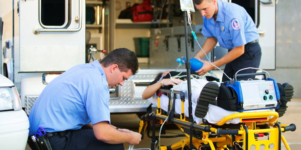 emergency medical services team helping patient