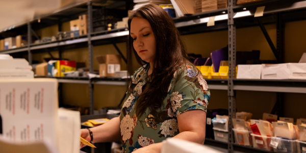 julie ardoline processing samples in office