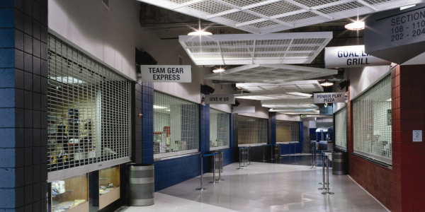 Security grilles in long arena hallway